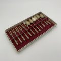 Apostle Snail Forks and Teaspoons in White Striped Case