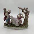 "Grown Staffordshire" Man Standing by Lady on Swing Figurine