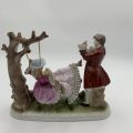 "Grown Staffordshire" Man Standing by Lady on Swing Figurine