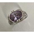 Silver plated Ring, Oval Purple Stone in lace design setting hearts on either side #ML576 R495.00...