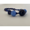 Necklace with Glass beads - Large blue round beads in the front with smaller blue beads in betwee...