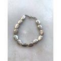 Silver Toned Bracelet With irregular Natural Oval Shaped Raised Disks #ML788 R120.00