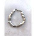 Silver Toned Bracelet With irregular Natural Oval Shaped Raised Disks #ML788 R120.00