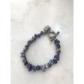 Bracelet With Irregular Shaped Blue Stones Split By Silver Coloured Round Beads With Pretty Clasp...