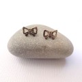 Earrings - Bow Stud Earrings. Gold Coloured#ML1027 R180.00 | Dimensions: 5 x 10mm