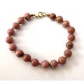 Bracelet - Dusty Pink Coloured Semi-precious stones On Thin Rope. Gold Colour Clasp #ML1609