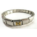 Bracelet - Stainless Steel Nomination Bracelet. One Gold Coloured H Link. (20 Links in total) ML1798
