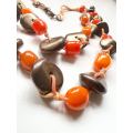 Necklace - Vintage Necklace 2 Swands. Orange Beads and Copper Tone Donut Shape Beads ML2003