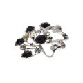 Brooch - Silver Tone Delicate Flower Brooch. 5 Black Rhinestones. 5 Clear Diamantes - ML3346