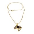 Pendant - Gold Tone Chain. Pendant Centre Red Stone with two Clear Rhinestones - ML3410