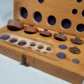 Wooden box with brass balance scale weights - incomplete