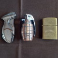 3 cigarette lighters - 1 novelty, one dark rum and 1 other - untested