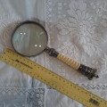 Magnifying glass with ivory colour handle and crown finial