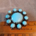 Torquoise blue milky glass vintage brooch 4 cms dia