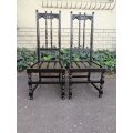 A Pair of Ercol English High Back Ebonised Slat Chairs