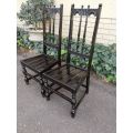 A Pair of Ercol English High Back Ebonised Slat Chairs