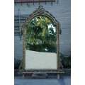 An Ornately Carved and Bevelled Gilded Mirror