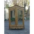 A 20th Century French Rococo Style Armoire with Bevelled Mirrors and Drawers finished in a contem...