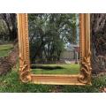Ornately Carved and Gilded Bevelled Mirror