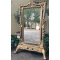 A Large Gilded Standing Mirror on Gilded Wooden Base