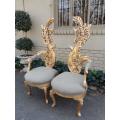 A Pair of Baroque Style Carved and Hand Gilded High Back Throne Chairs (upholstered linen upholst...