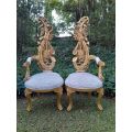 A Pair of Baroque Style Carved and Hand Gilded High Back Throne Chairs (upholstered linen upholst...