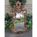 Gilt And Carved Wooden Mirror