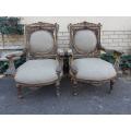 A 20th Century Pair (over 80 years old) of French Style Ornately Carved and Gilded Arm Chairs Uph...