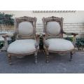 A 20th Century Pair (over 80 years old) of French Style Ornately Carved and Gilded Arm Chairs Uph...