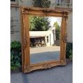 Large gilt-painted bevelled mirror