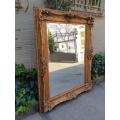 Large gilt-painted bevelled mirror