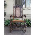 19th Century Ornately Carved Flemish Throne Chair With Rattan Back And Seat