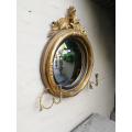 A 19th Century Regency Style Convex Giltwood Mirror