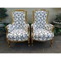 A Pair of Late 19th Century French Bergere Chairs Hand Gilded with Gold Leaf and Upholstered in i...