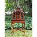 A 20th Century French Carved Mahogany and Walnut Victorian Cathedral Style Birdcage on Stand
