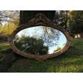 Ornately Carved Oval Gilded Mirror