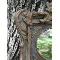 Ornately Carved Oval Gilded Mirror