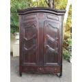 An 18th Century/early 19th Century French Walnut Dauphinoise armoire from the North of Lyon which...