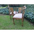 An Antique French-Style Carved Conversation Settee Hand-Gilded and Upholstered in a Custom-made S...