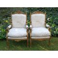 Pair of 19th Century style gilded and carved armchairs