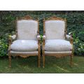 Pair of 19th Century style gilded and carved armchairs