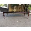 Victorian mahogany almost 3 meter twelve-seater extending dining table on castors