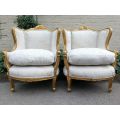 A Pair Of 20th Century French Style Gilt Bergere Armchairs Upholstered In A Custom-Made Hand Prin...