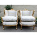 A Pair Of 20th Century French Style Gilt Bergere Armchairs Upholstered In A Custom-Made Hand Prin...
