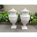 A Pair Of Concrete Urns With Handles And Lids