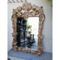 A 19th Century Bevelled And Carved Giltwood And Carved Wooden Mirror