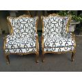 A Pair Of 20th Century French Gilt Wingback Armchairs