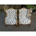 A Pair Of 20th Century French Gilt Wingback Armchairs