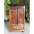 An 18th Century French Walnut Port Armoire Of Large Proportions And With Cast Iron Hinges