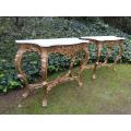 An Ornately Carved Pair or Marble Topped and Hand-gilded with Gold Leaf Console Tables